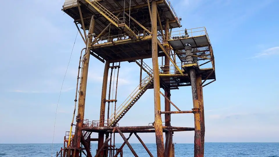 Offshore oil platform under a blue sky