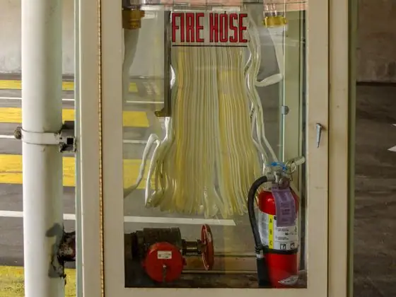 Fire hose and extinguisher station
